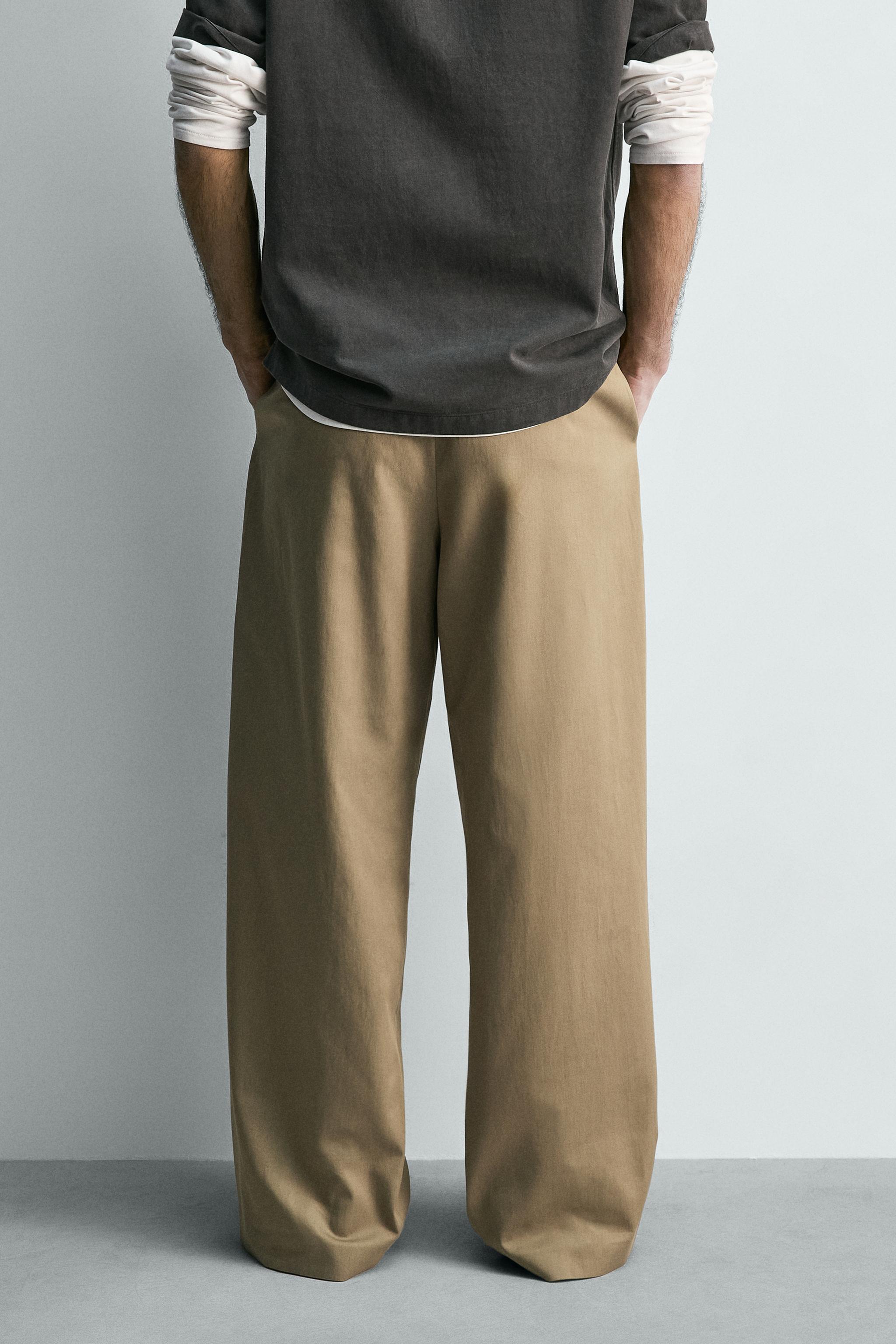 FLOWY PLEATED BELTED PANTS